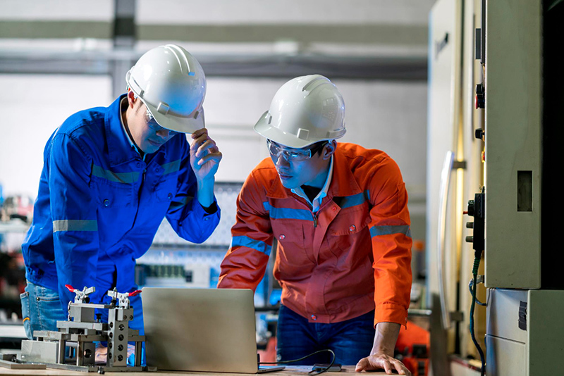 two engineering professionals discussing