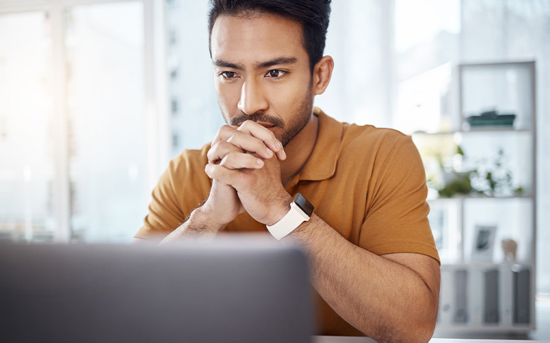 Man pondering AI's impact on his job.