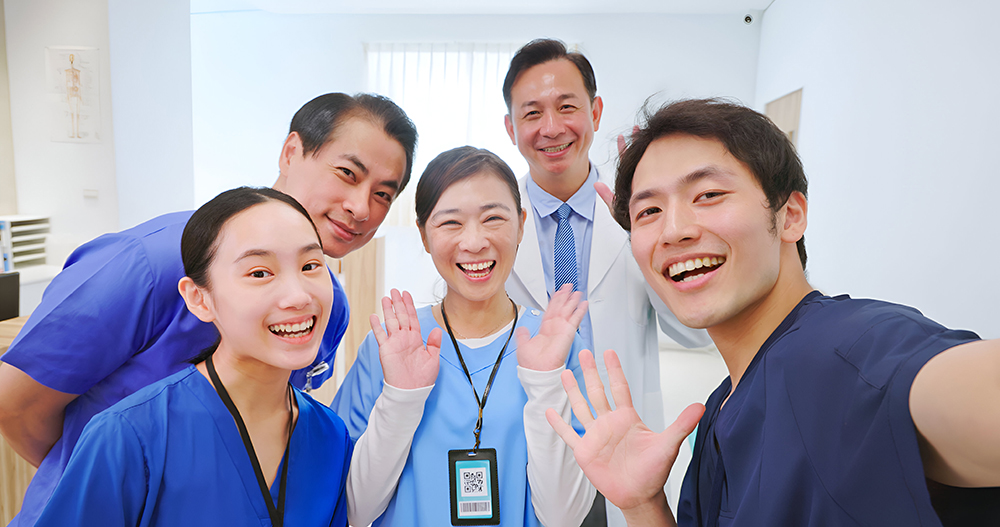 group of healthcare professionals taking selfie