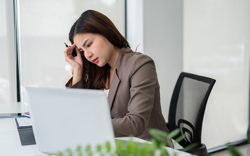 Businesswoman feeling stressed due to career stagnation