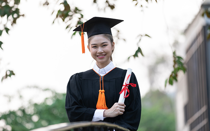 Recent graduate with certificate in hand