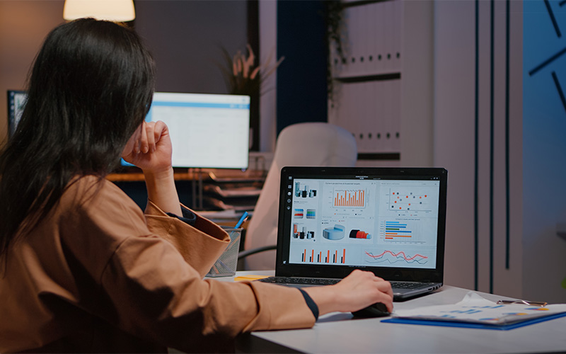 worker analysing data on a laptop in a quiet office