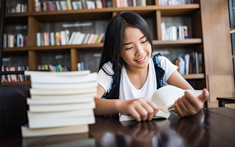 student studying quietly at a library