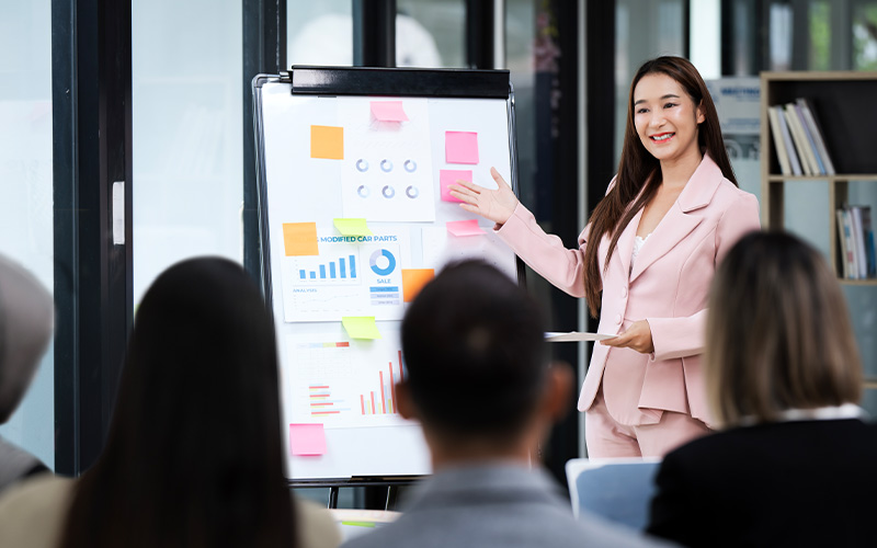 Accountant giving a presentation on financial charts.